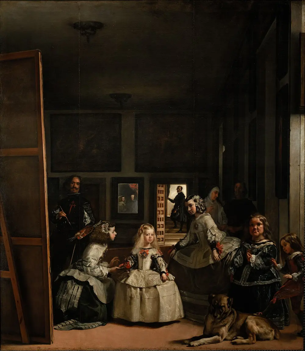 A tall, dim palace room: a little princess in a wide silver dress stands at the centre with maids of honour, two court dwarfs and a big dog, while the painter stands at a huge canvas on the left and a small mirror on the back wall shows a king and queen.