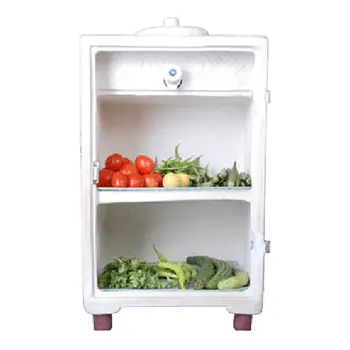 A small white clay cabinet on short legs, with a lid and a small tap on its top section and two shelves of tomatoes, beans and other vegetables below.