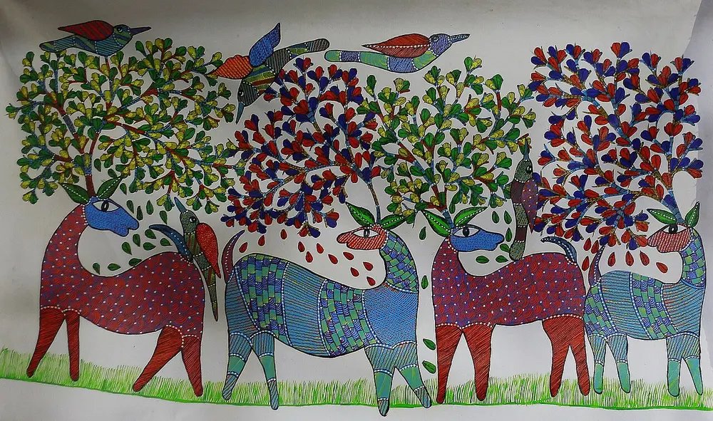 Four deer in red, blue and purple, their bodies filled with tiny dashes and lines, stand under trees covered in coloured leaves while birds fly above.