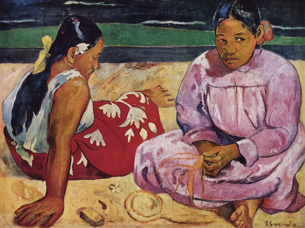 Two Tahitian women sit on yellow sand: one in a red and white wrap turns away, the other in a pink dress looks to the side, with flat bands of green and dark blue sea behind them.