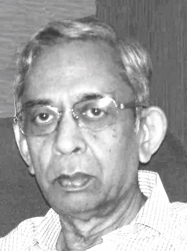 A black and white photograph of an older Ram Mohan with grey hair and glasses, in a white shirt.