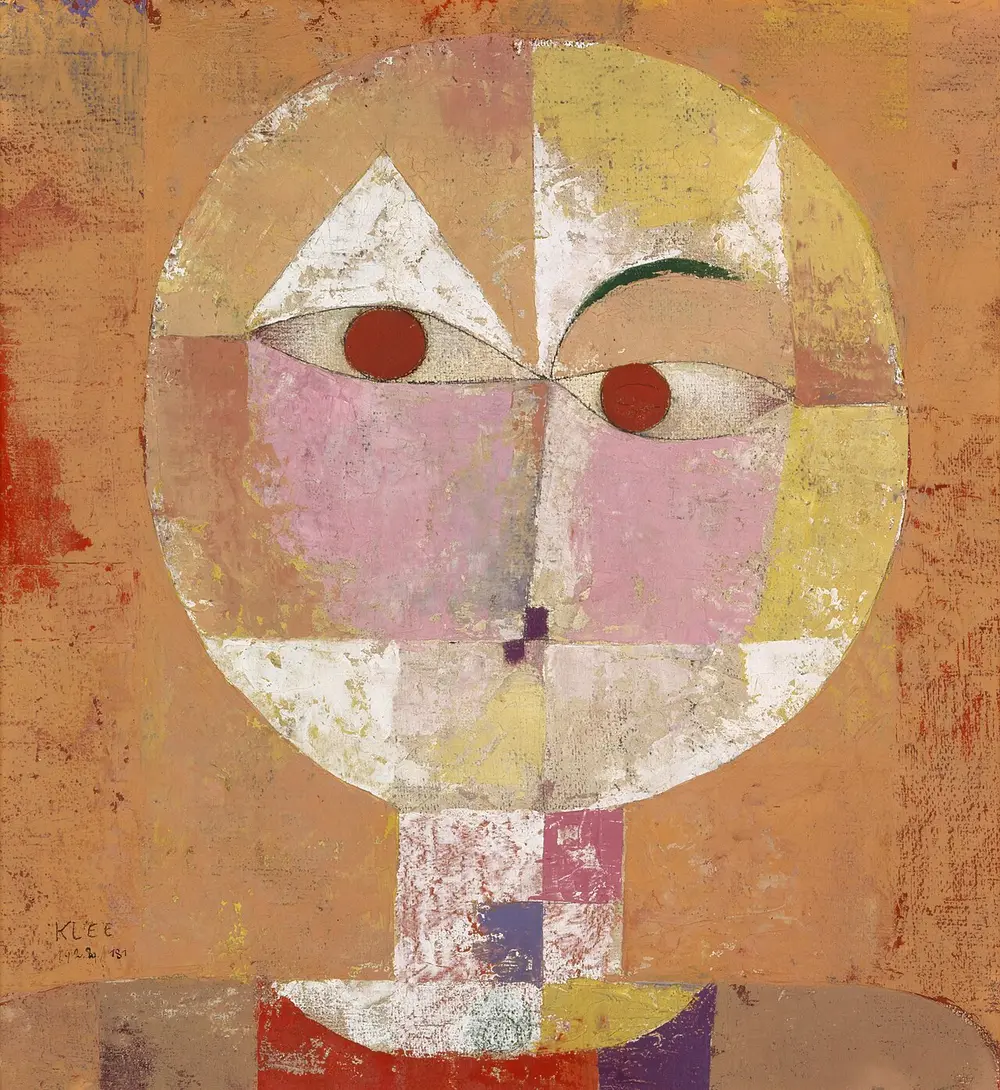 A round, mask-like face split into soft squares of orange, pink, yellow and white, with two red dot eyes, on an orange background.
