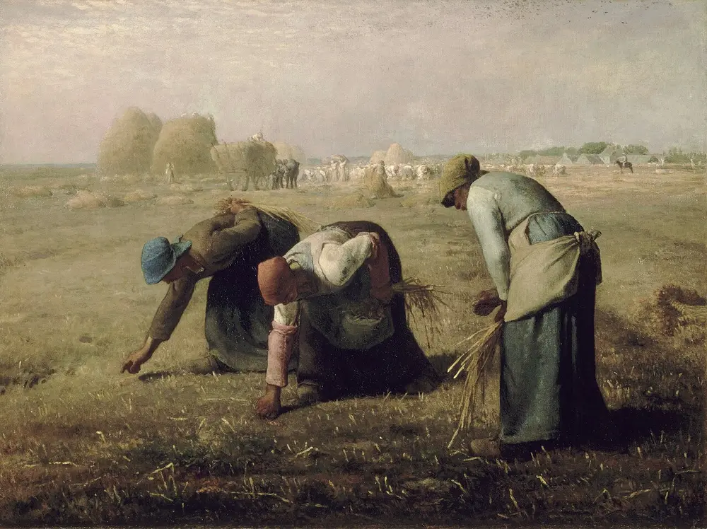 Three peasant women in a flat golden field bend low to pick up leftover stalks of wheat, while far behind them stand huge haystacks, a cart and harvest workers in the hazy light.