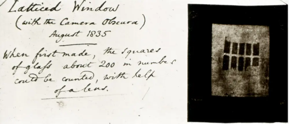 A handwritten note reading "Latticed Window (with the Camera Obscura) August 1835" beside a tiny square brown negative in which the window's lattice of small panes shows in reverse tones.