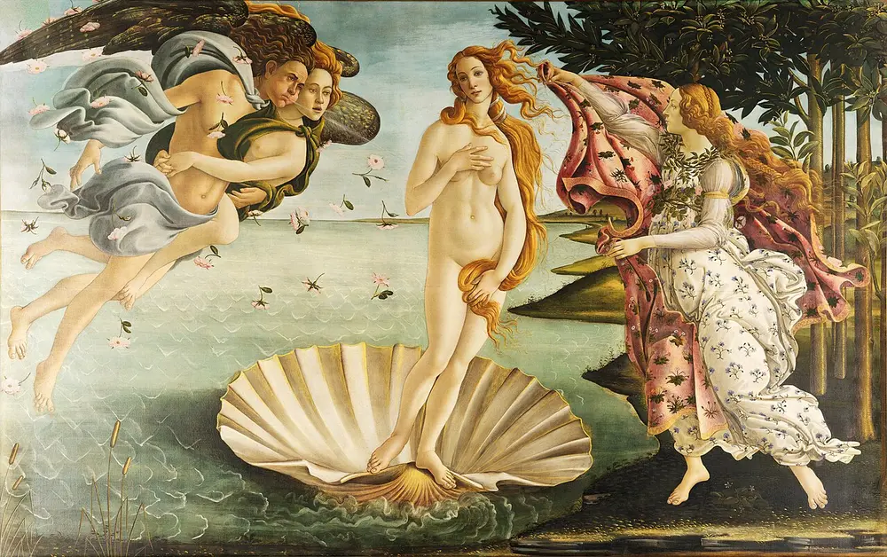 The goddess Venus, nude with long red-gold hair, stands on a large scallop shell on the sea while wind gods blow her to the shore and a woman waits with a flowered cloak.