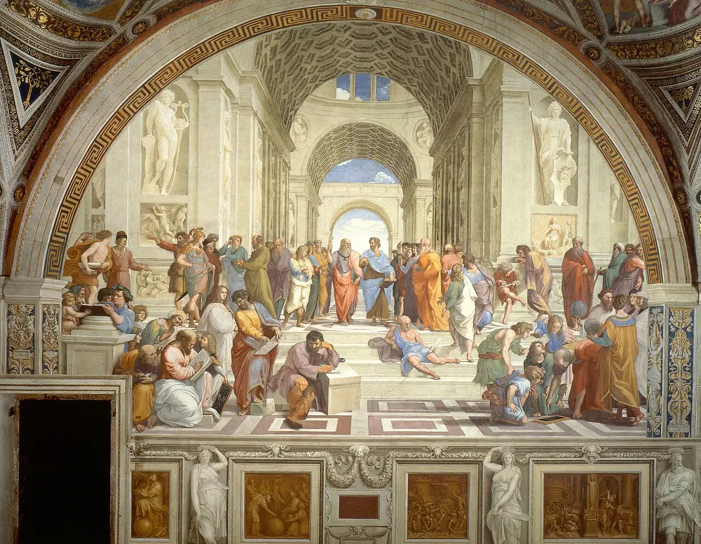A fresco of a grand arched hall with many ancient thinkers on wide steps; at the centre Plato points up and Aristotle holds his hand out flat.